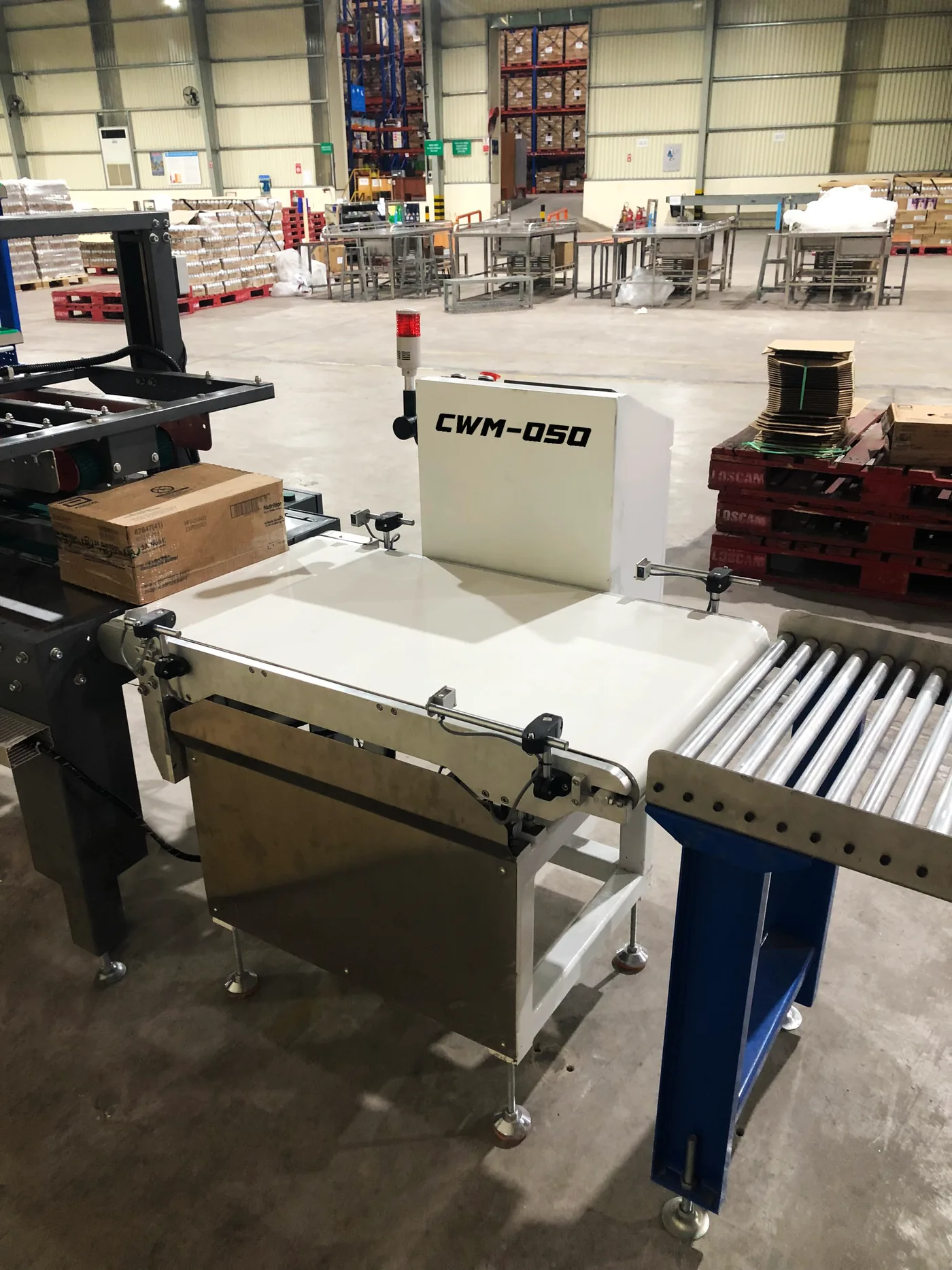 Installed between conveyors on the warehouse line