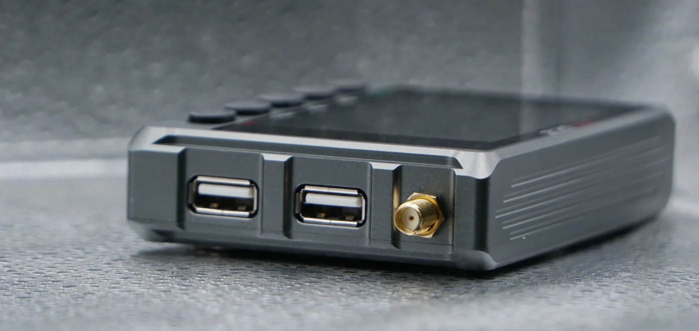 Side of the Micro DNC 2D with two USB ports and the Wi-Fi antenna connector
