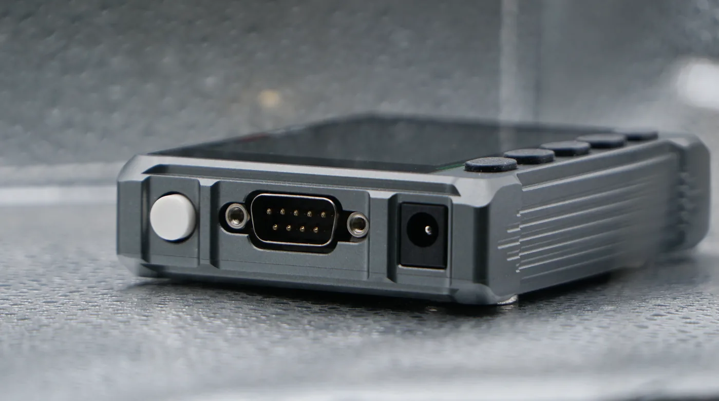 Side of the Micro DNC 2D with the DB9 RS232 port, 12 VDC power jack and power button